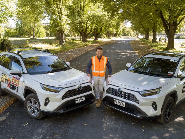 CORDE City to Sea West Pathway project manager Marc Bos with two CORDE company vehicles sign...