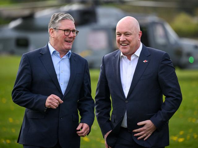 British Prime Minister Keir Starmer greets Christopher Luxon after he arrives for a visit to a...