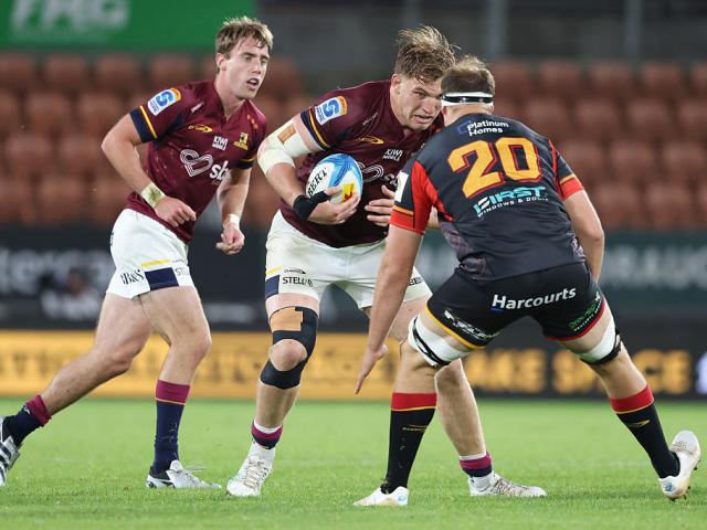 Fabian Holland of the Highlanders braces for the tackle during their match against the Chiefs in...