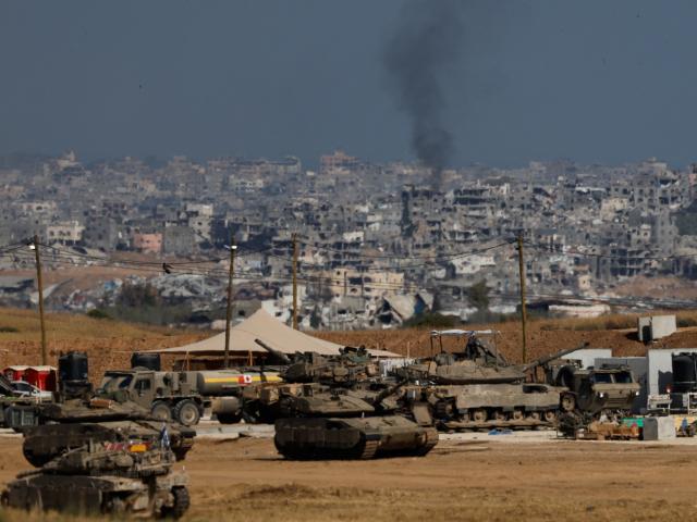 Military vehicles stand near the border with Gaza, in Israel. Photo: Reuters 