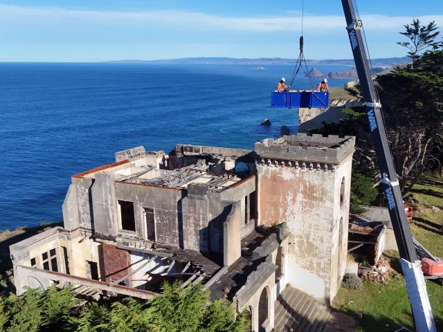 Contractors John Ace Nucasa (left) and Steven Rainbow begin installing stabilising bracing on...