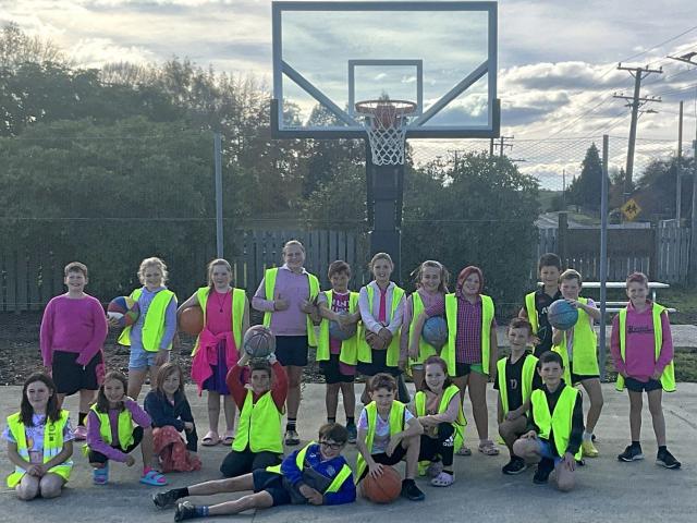 Heriot primary school seniors under the new hoop at the towns refurbished courts, last week....