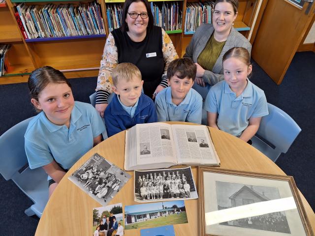Excited to show their photo archives for the Wallacetown School 160 jubilee are principal Lisa...
