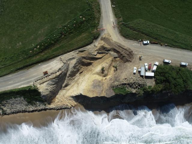 Holes left from digging up road to extract 19,000 tonnes of old refuse left the erosion-prone...
