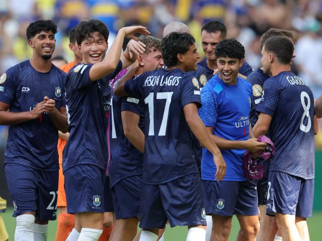 Auckland City players celebrate after drawing with Boca Juniors at the Club World Cup yesterday....