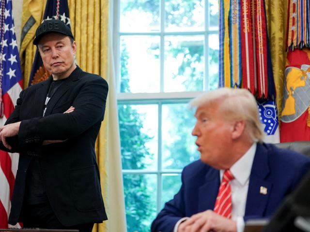 Elon Musk (L) and US President Donald Trump attend a press conference in the Oval Office of the...