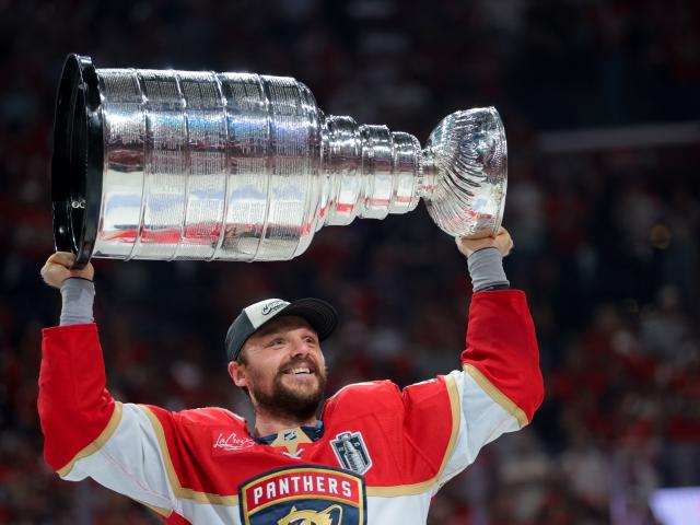 Florida Panthers forward Sam Reinhart hoists the Stanley Cup after his side beat the Edmonton...