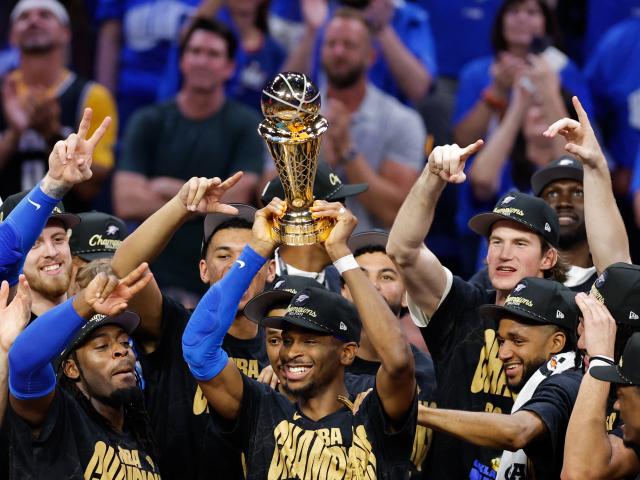 Oklahoma City Thunder players celebrate as Shai Gilgeous-Alexander lifts the Larry O'Brien...
