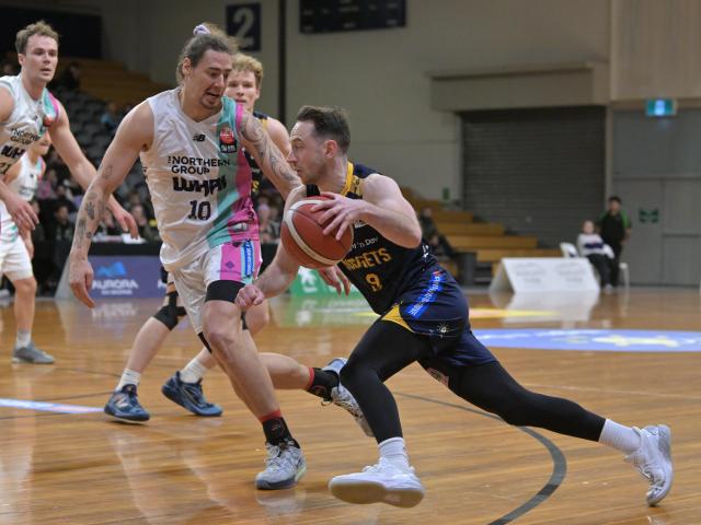 Nuggets player Darcy Knox darts low past Whai defender Denhym Brooke during their game at the...
