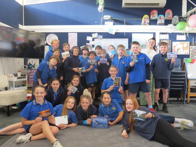 Clyde Primary School teacher Sydney Robertson and the year 6 and 7 Korimako class show off with...