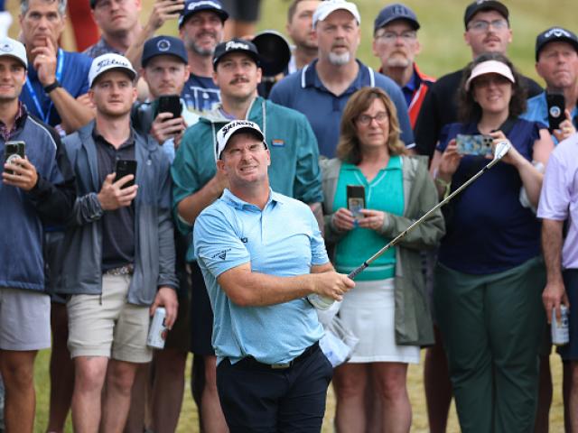 Ryan Fox closes his eyes and hopes after his second shot on the 18th hole at Oakmont. Photo:...