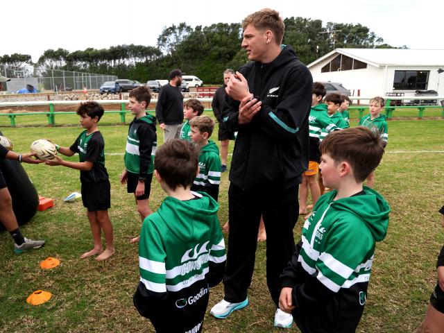 Fabian Holland runs a skills session with youngsters at the Coastal Rugby Club, in Taranaki,...