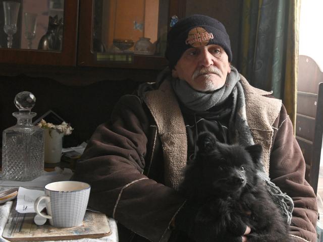 South Dunedin resident Kevin Kehoe, holding his dog Shady, is planning to sell his flood-damaged...