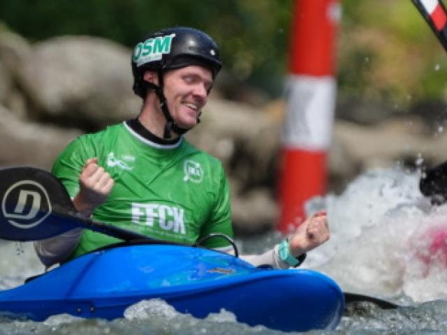 Nick Collier celebrates his win in the kayak cross at the junior canoe slalom world championships...
