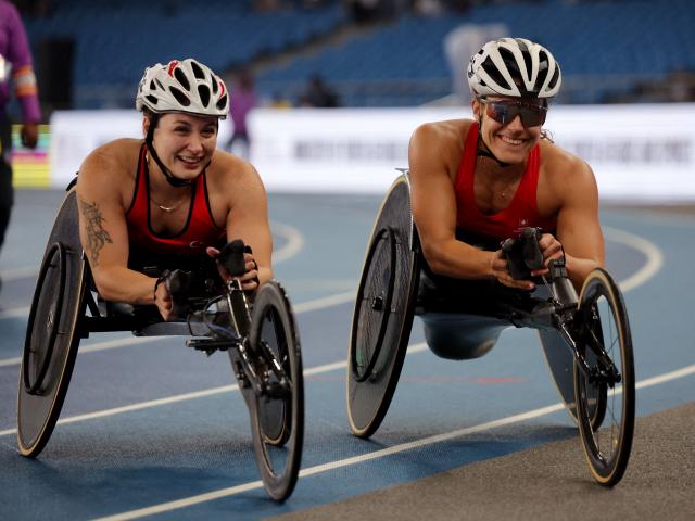 Gold medallist Catherine Debrunner (right), of Switzerland, celebrates with silver medallist...