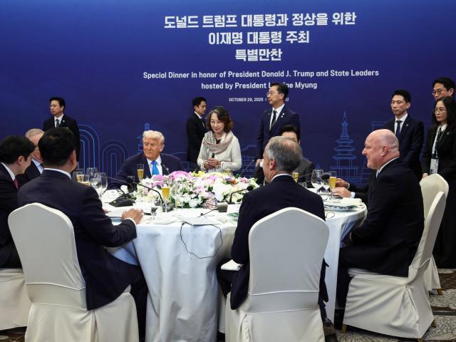 An intimate dinner party at the Apec conference in South Korea, featuring US President Donald...