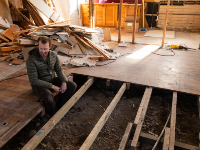 Warren Fitzgerald looking at the uncompleted work at his property. Photo: RNZ / Samuel Rillstone