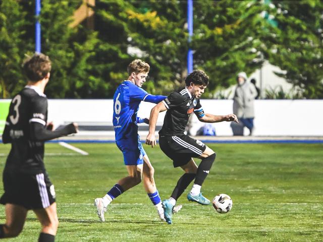 Christchurch United and Coastal Spirit captains Jago Godden and Joe Hoole clash during the sides'...
