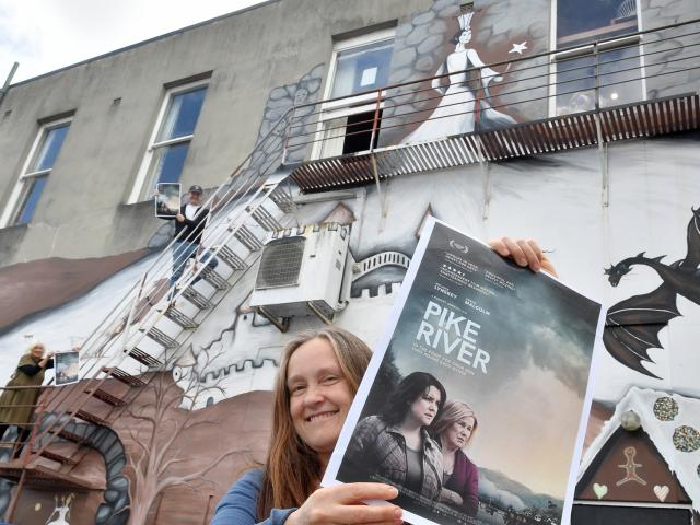 Playhouse Theatre committee member Shannon Colbert holds a poster for the Pike River Dunedin...