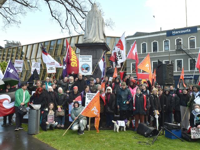 Some of the estimated 100 people who braved Dunedin’s rain and hail yesterday to mark Rā...