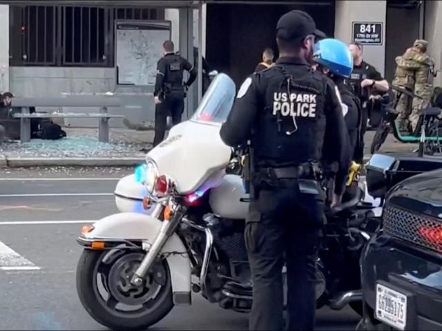 Officers at the scene where two members of the National Guard were shot at in Washington DC in...
