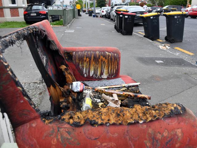 Used fireworks sit atop a damaged couch in Castle St North yesterday morning. PHOTO: STEPHEN...