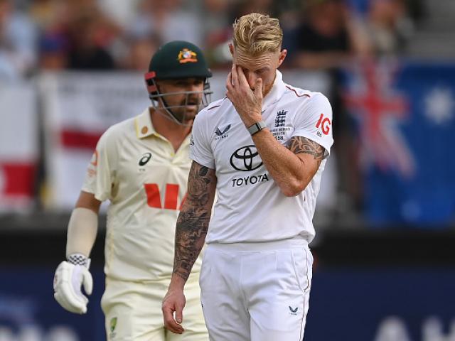 England captain Ben Stokes reacts to another Travis Head (rear) boundary during the first Ashes...