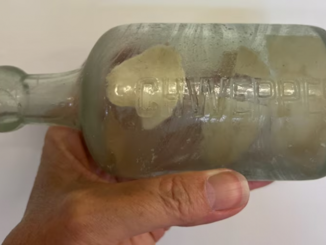 The Esperance family who found the bottle had to use tweezers to remove the letter. Photo:...