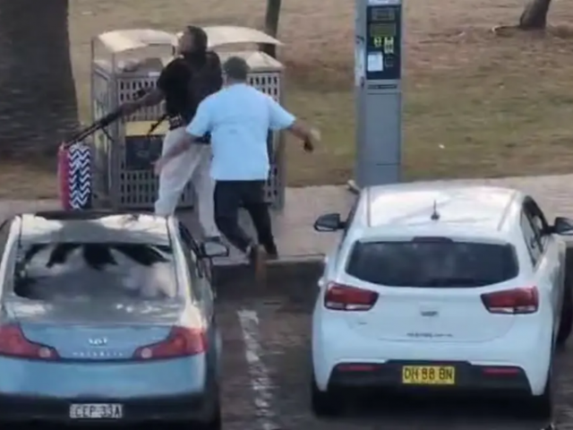 A man in civilian clothing jumps on the shooter before disarming him. Photo: Screenshot/Supplied 