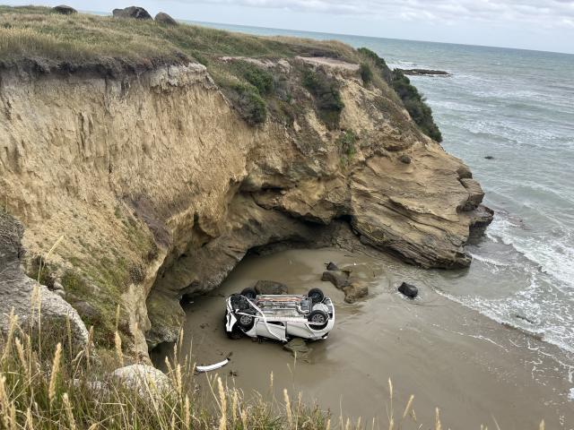The car ended up at the bottom of a cliff near Kakanui. Photo: Nic Duff 