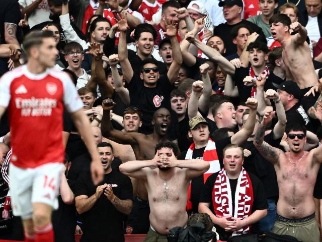 Arsenal fans celebrate a goal. PHOTOS: REUTERS
