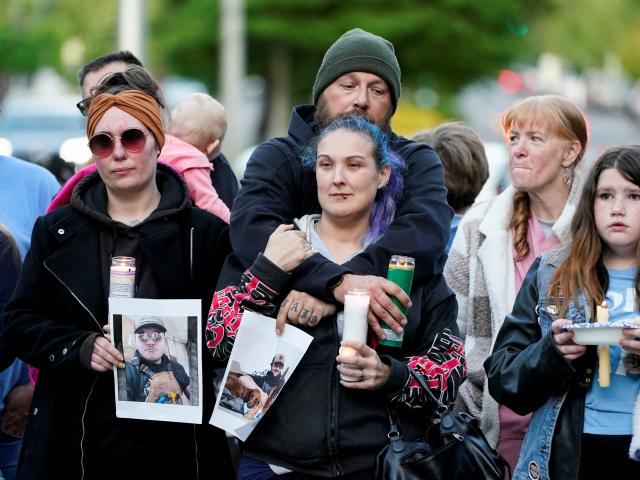 Families of people working at the pulp and paper mill attended a vigil. Photo: Reuters 