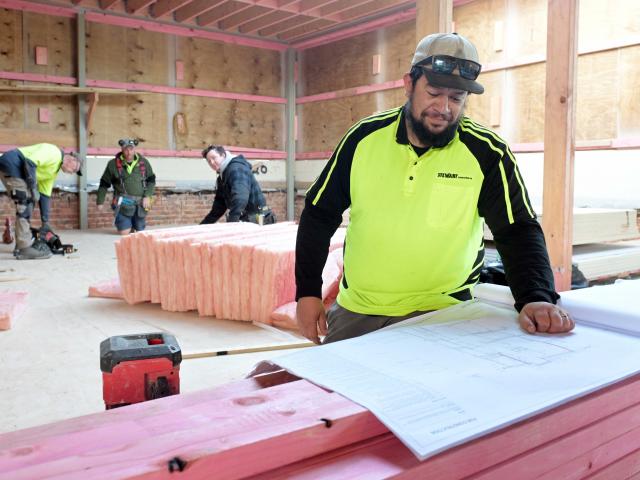 Stewart Construction second-in-charge Nathan Evans gets to work at a building site in St Clair....