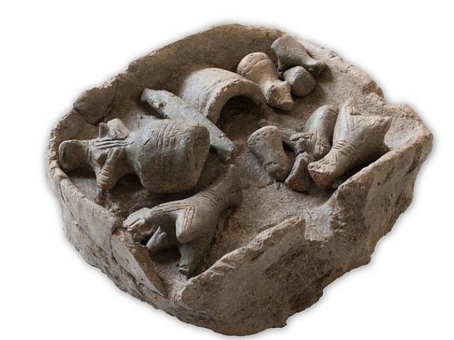 The model of a 7500-year-old house from Zarkou, in Greece. The model is 19cm wide. Notice the...