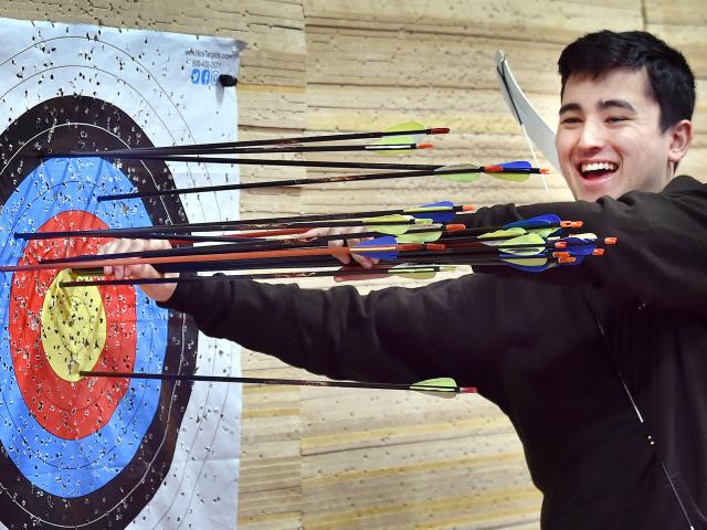 Otago University Archery Club president Charlie Boocock-Yee removes arrows from the club’s new...