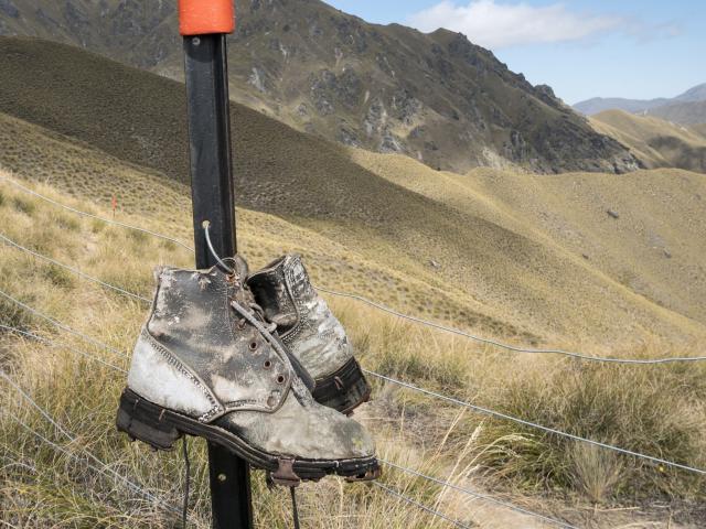 Boots on a marker pole. Photo: Scott K MacLeod