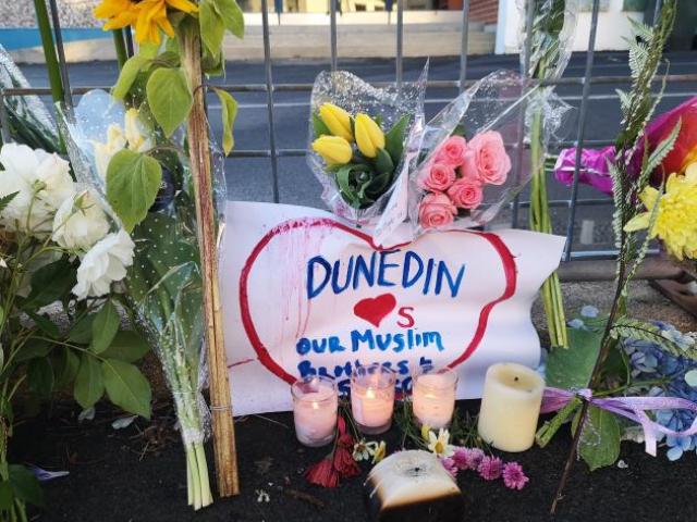Flowers and candles were left outside Dunedin's Al Huda mosque after the attacks. 