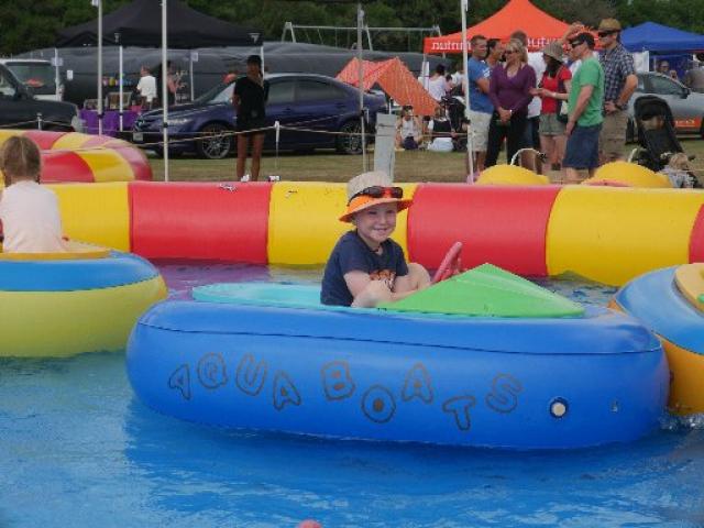 Floating by...Fabian Weir (then 5), of Fairfield, plays in an aqua boat at the Brighton Gala Day...