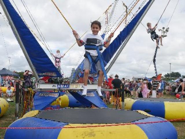 High flyer...Armani Ngaia (then 6), of Brighton, bounces on the Amac Bungy at last year's gala...