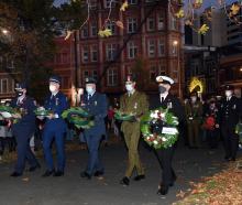 Service personnel lay wreaths at the dawn service at the Cenotaph in Queens Gardens. PHOTO:...
