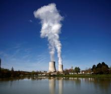 Steam rises from cooling towers of the Electricite de France nuclear power station in Civaux,...