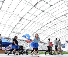Participants in the Dunedin Relay for Life fundraiser complete laps at Forsyth Barr Stadium on...