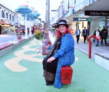 Cr Mandy Mayhem tests the playground equipment installed as part of the George St upgrade. Photo:...