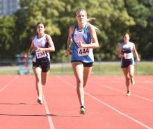 Queen’s High School runner Seddah McGregor, 15, charges to victory in the 400m at the Otago...