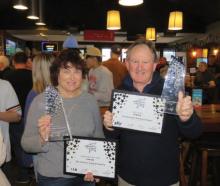 Naomi and Marty Fuller with their hospitality awards of excellence. Photo: Supplied