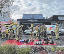 Ashburton Volunteer Fire Brigade members outside Stoked Cycles on Burnett St. Photo: Supplied