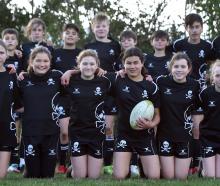 The Pirates year 7 rugby team at Hancock Park yesterday (front from left) Lily Gordon, True...