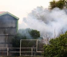 Smoke rises from a fire in a building at the vacant former hospital site in Joy St, Oamaru,...