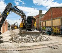 Diggers work to create a pedestrian corridor into the mall from Hawke St. Photo: Geoff Sloan
