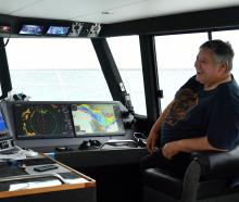 Tane Fisher at the helm of Te-Maree. PHOTOS: STEPHEN JAQUIERY